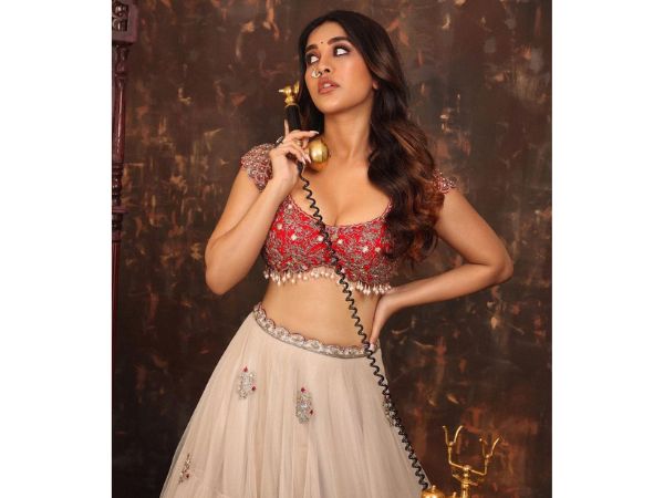 Actress Nabha Natesh Mesmerizing Stills In Red Lehenga