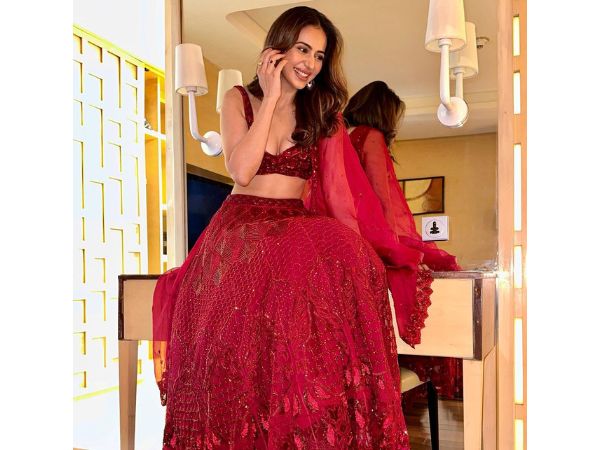 Actress Rakul Preet Singh Glamorous Stills In Maroon Lehenga