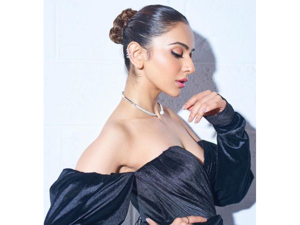 Actress Rakul Preet Singh Ravishing Stills In Black High Slit Dress