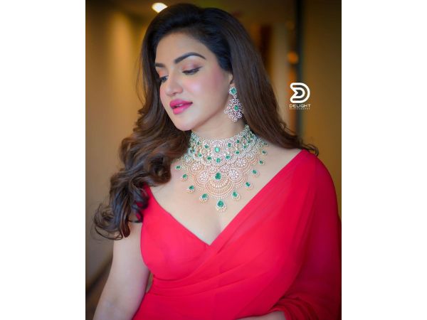 Actress Honey Rose Ravishing Stills In Red Saree