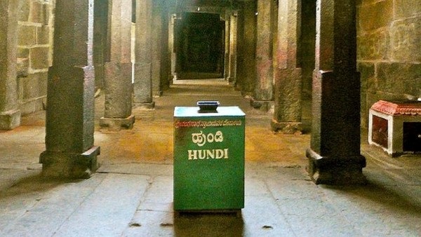 Viral video A thief who was caught trying to steal money from a hundi in a temple