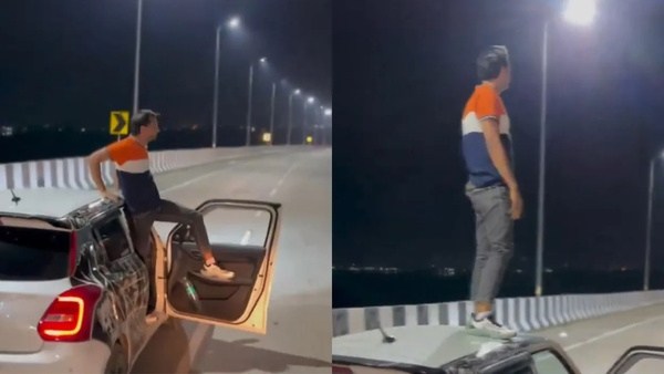 man-stands-on-car-roof-top-while-driving-in-rajasthan-video-viral-on-social-media-netizens-on-fire man-stands-on-car-roof-top-while-driving-in-rajasthan-video-viral-on-social-media-netizens-on-fire
