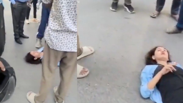 Woman with cigarette and alcohol bottle creates ruckus on road viral