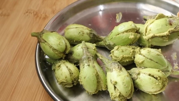 Stuffed Brinjal Masala Curry preparation with Fresh Green Chili Paste