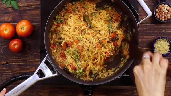 Tomato semiya upma with ghee and oil light food for healthy breakfast Tomato semiya upma with ghee and oil light food for healthy breakfast